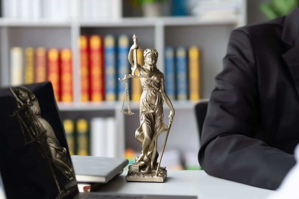 Lady Justice statue in a law office representing trusted immigration legal representation in Dallas, TX.