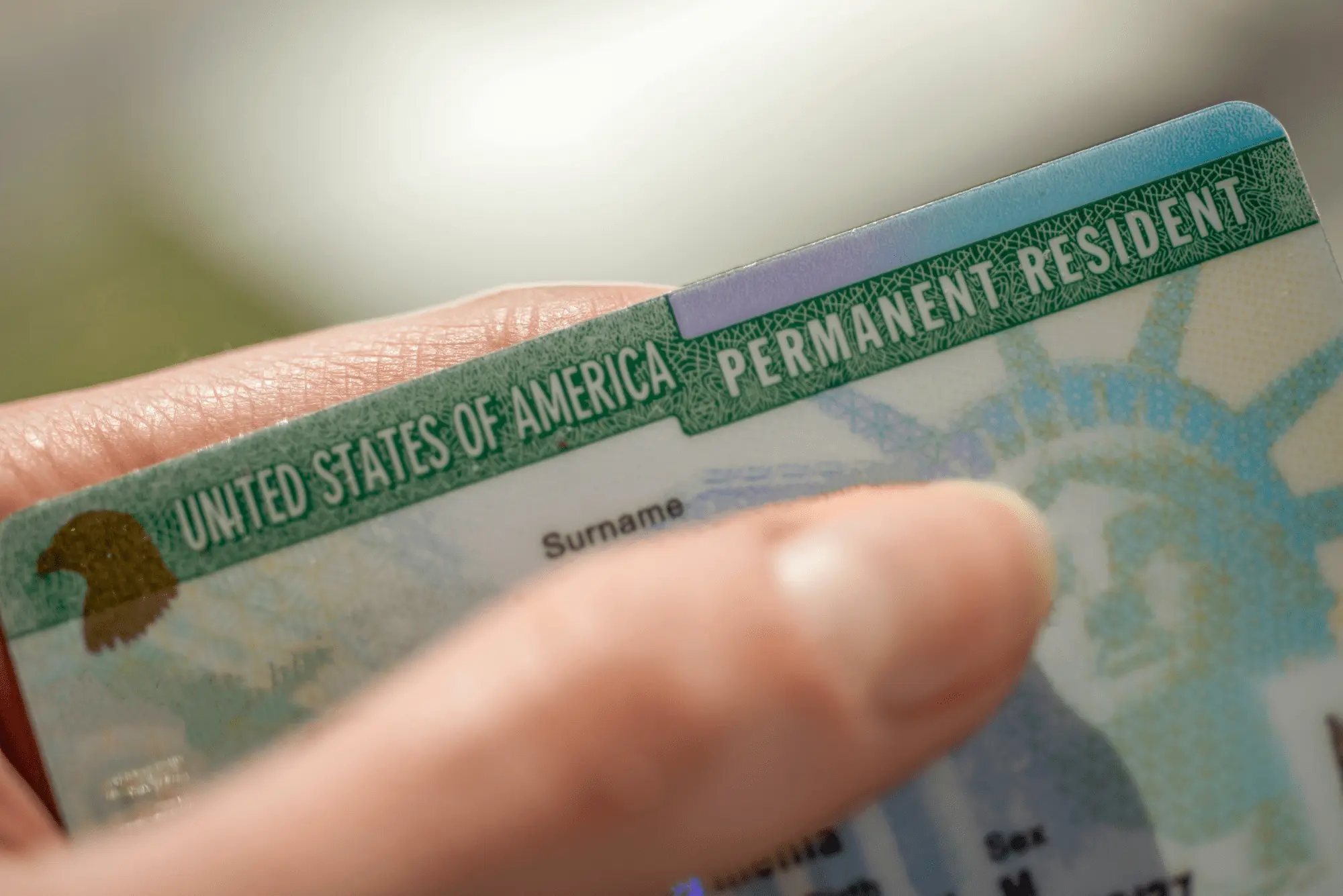 Close-up of a United States Permanent Resident Card for green card immigration services.